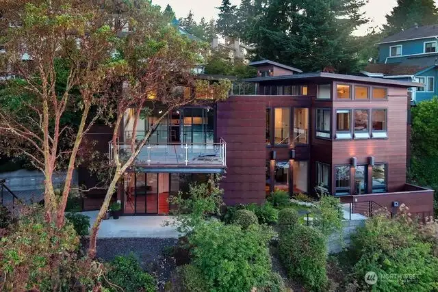 Home faces the harbor with glorious views overlooking Seattle Yacht Club.  A multi facit estate designed by Anna Howden, Architect. Received a LEED Certification for environmental design and efficiency.