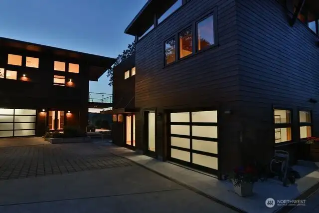 Evening view of detached guest house apartment. Across the courtyard is the main house ground level entry. There is an elevator inside main house to take you to the 2nd floor level.