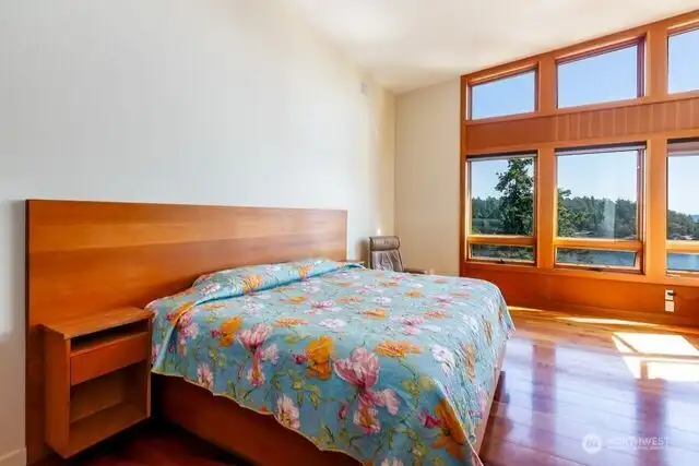 Primary bedroom has views toward the harbor and Mount Baker.