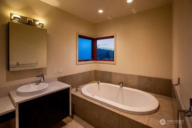 Primary bath has a jetted tub.