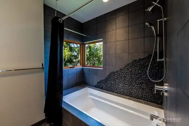 Guest bedroom has a full bath, custom designed.