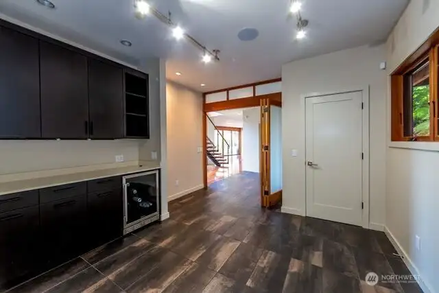 This room is a bonus room, previously used as owner's sewing room.