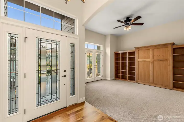 Entry is bright and open to room with a convenient murphy bed that stays!