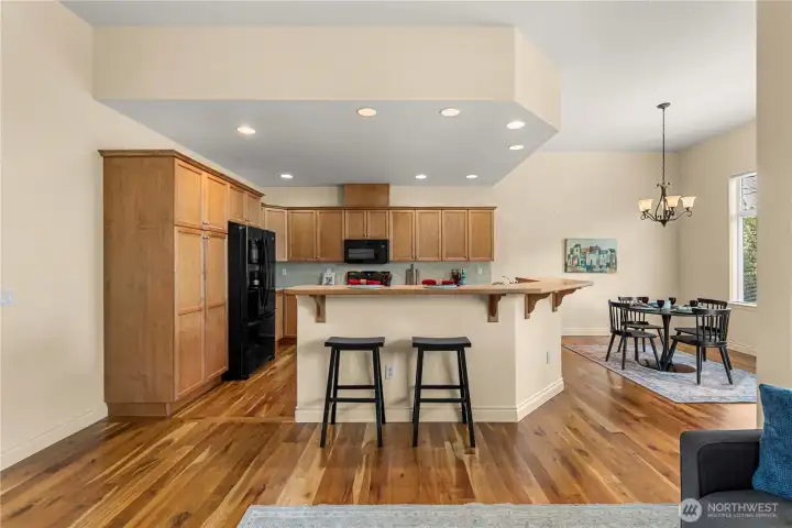 Cabinets have pull outs with high quality appliances and spacious dining area