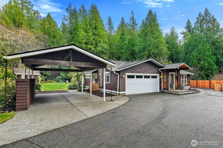 A mulit-function carport (hang kayaks, RV parking, outdoor covered entertainment area), and an attached sheet-rocked garage for your PNW lifestyle!