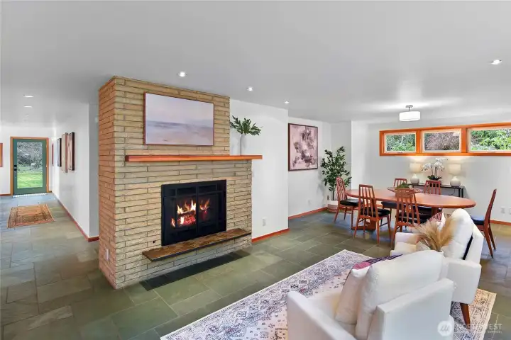 Classic and original 70's blonde brick fireplace. Split faced Brazilian slate flooring throughout main living area.