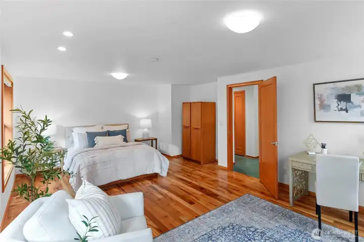 Oregon myrtle hardwood floors in both bedrooms.