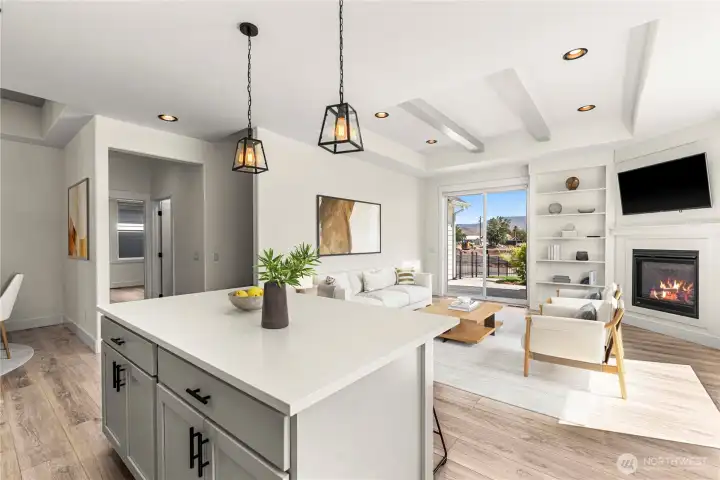 Great Room with built-ins, gas fireplace, and patio access. Lives Large