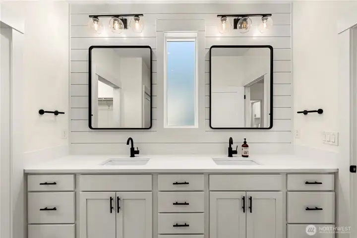 Double Vanity. Custom cabinets and quarts counter tops with striking hardware.