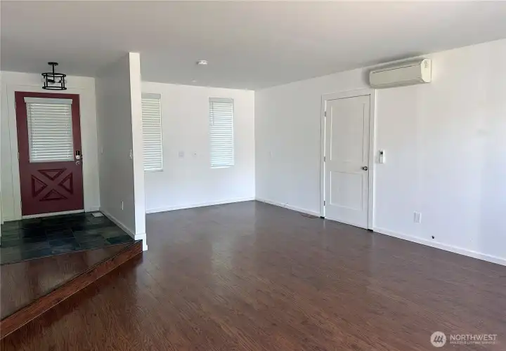 Living room with nook for den/office work area