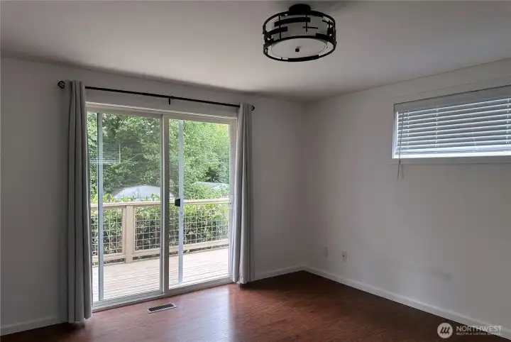 Master bedroom with sliding doors onto deck
