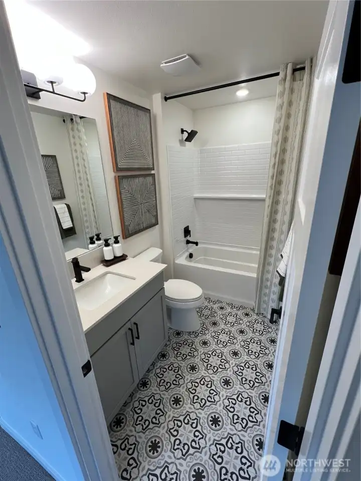Guest bathroom of model home. Finishes and features may vary.