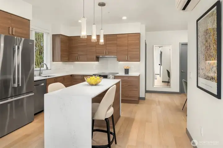 Beautiful wide-plank engineered hardwood flooring throughout.