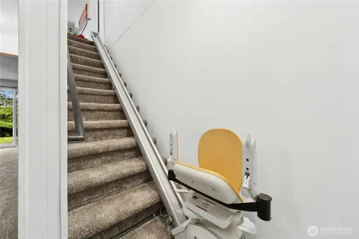 Stairs to downstairs. Electric chair can stay or Seller can remove-Buyer's choice!