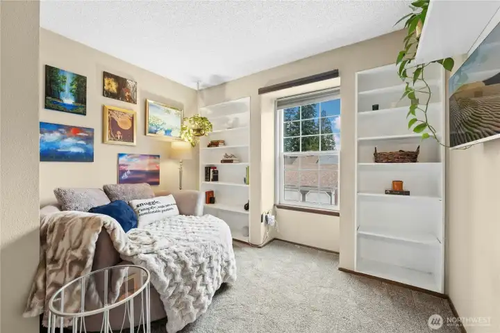 2nd bedroom upstairs; multiple use room-reading, office, bedroom. Built-in shelving.