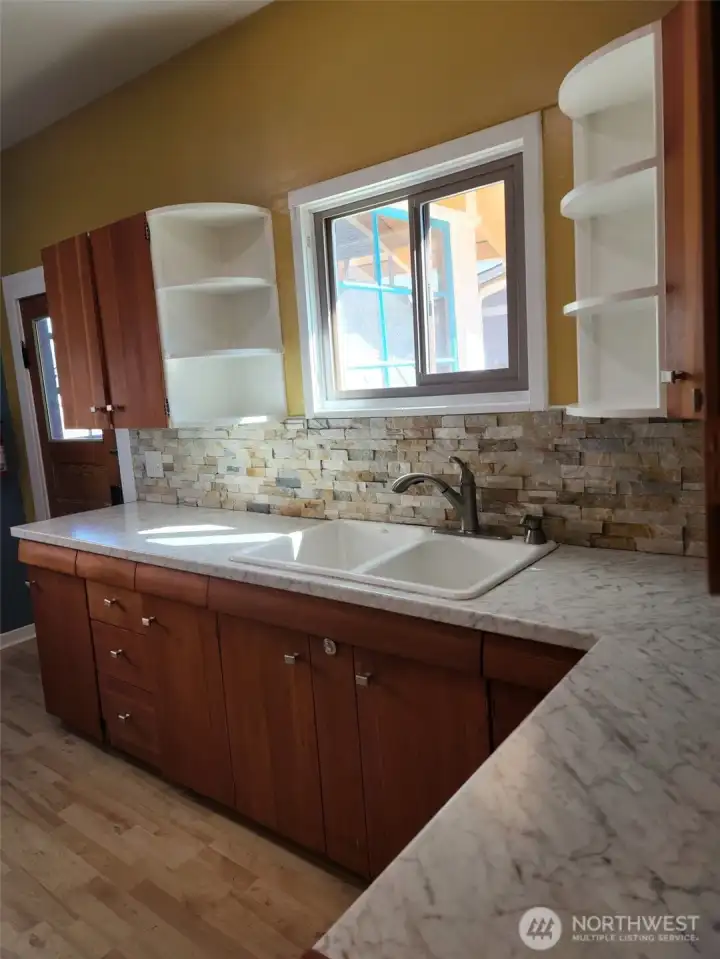 Kitchen showing sink and cabinets.