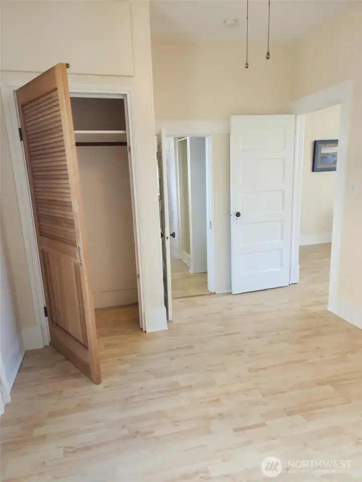 Bedroom, looking toward bathroom and door into living room.