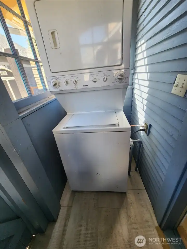 Entry porch off kitchen is also utility area with stacked washer/dryer.