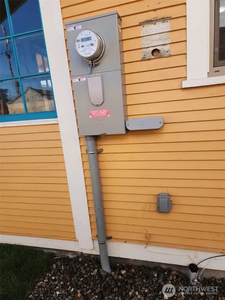New electric panel with underground service.  Also shows 220 outlet for a car charger. There is also underground feed for the fiber optic service, Quantum fiber.