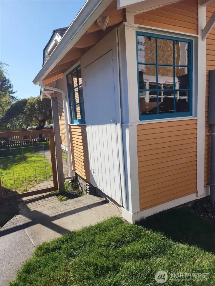 Back door of the home, enters into porch.