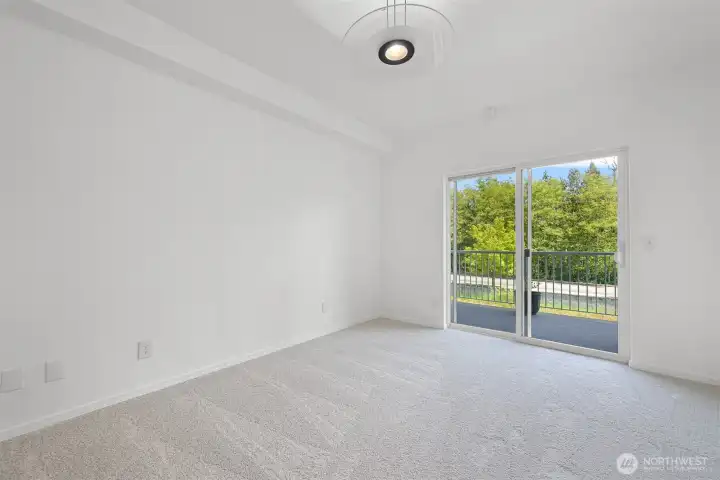 Primary bedroom #2 with sliding glass & doors to balcony