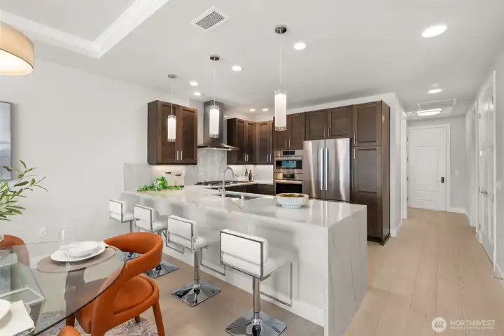 Oh my... the granite was an expensive and gorgeous upgrade. Note the waterfall finish and breakfast bar for informal bites. Oh my... the granite was an expensive and gorgeous upgrade. Note the waterfall finish and breakfast bar for informal bites.