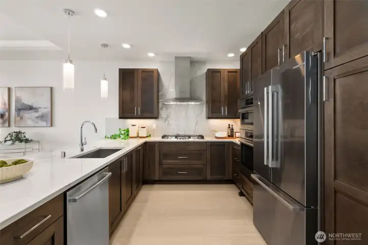 A chef would love this kitchen...it is appointed with premium stainless appliances, rich soft-close cabinetry, and an expansive entertaining island. A chef would love this kitchen...it is appointed with premium stainless appliances, rich soft-close cabinetry, and an expansive entertaining island.