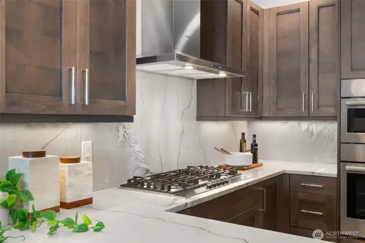 Custom GRANITE full-height backsplash is truly a striking showpiece and was an expensive upgrade. Notice the design which is 100% unique to this residence. Custom GRANITE full-height backsplash is truly a striking showpiece and was an expensive upgrade. Notice the design which is 100% unique to this residence.