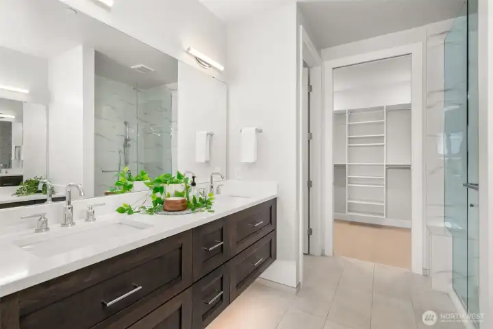 The primary bath offers a serene retreat making you feel that you are "worth it" with refined finishes, dual vanities, and a calming sense of understated luxury. The under-cabinet lighting makes late night visits easy and the heated floors in the bath will be very appreciated. The primary bath offers a serene retreat making you feel that you are "worth it" with refined finishes, dual vanities, and a calming sense of understated luxury. The under-cabinet lighting makes late night visits easy and the heated floors in the bath will be very appreciated.