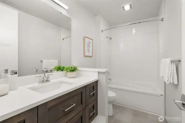 Guest bath appointed with clean modern finishes and timeless design Guest bath appointed with clean modern finishes and timeless design