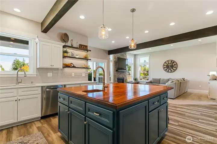 Wood beams frame add architectural interest and add to the custom feel of the home