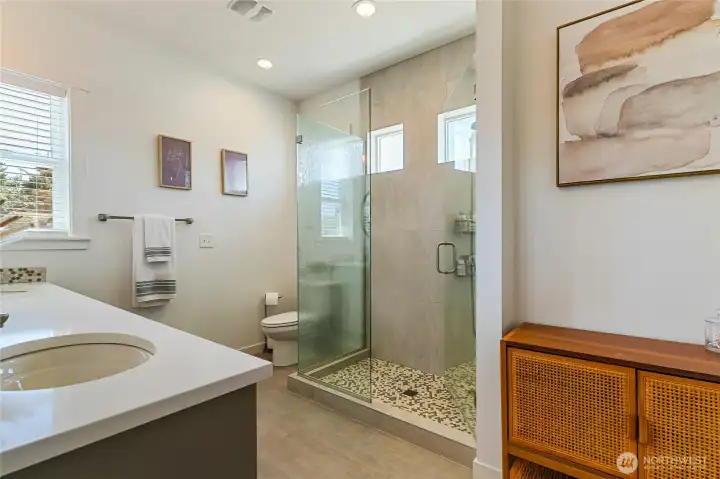 Over-sized walk in tiled shower in Primary Bath