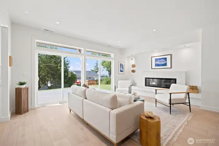 The living room looks out to Drayton Harbor and there is a sleek and gorgeous electric fireplace. The living room looks out to Drayton Harbor and there is a sleek and gorgeous electric fireplace.