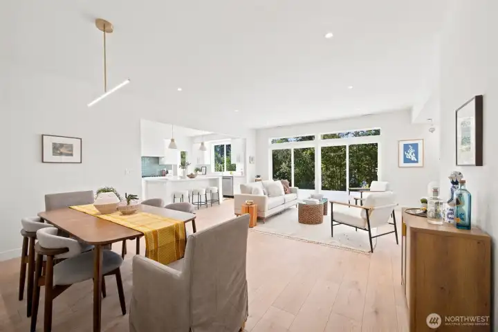 Looking across the open floor plan from the spacious dining room that has an incredible light fixture, and so much space. Looking across the open floor plan from the spacious dining room that has an incredible light fixture, and so much space.