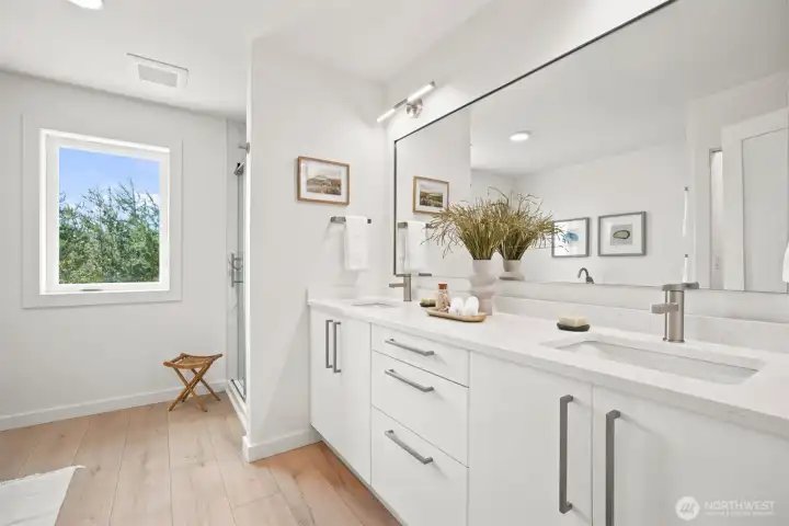 The full bath off the primary bedroom is incredible with a separate shower and dual sink vanity. The full bath off the primary bedroom is incredible with a separate shower and dual sink vanity.