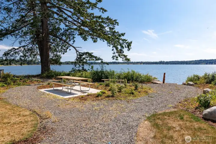 There is a community table and bench to take in the salt water views! There is a community table and bench to take in the salt water views!