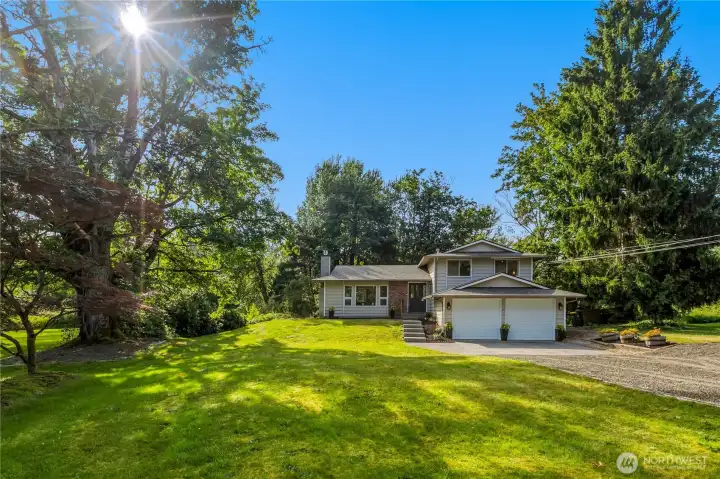 Nestled on over five acres, this property offers open lawn space, mature trees, and a setting that balances privacy with convenience. Nestled on over five acres, this property offers open lawn space, mature trees, and a setting that balances privacy with convenience.