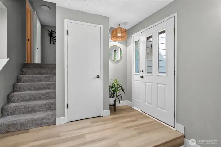 Step inside to an inviting entry featuring updated flooring and a welcoming transition into the home's main living spaces. Step inside to an inviting entry featuring updated flooring and a welcoming transition into the home's main living spaces.