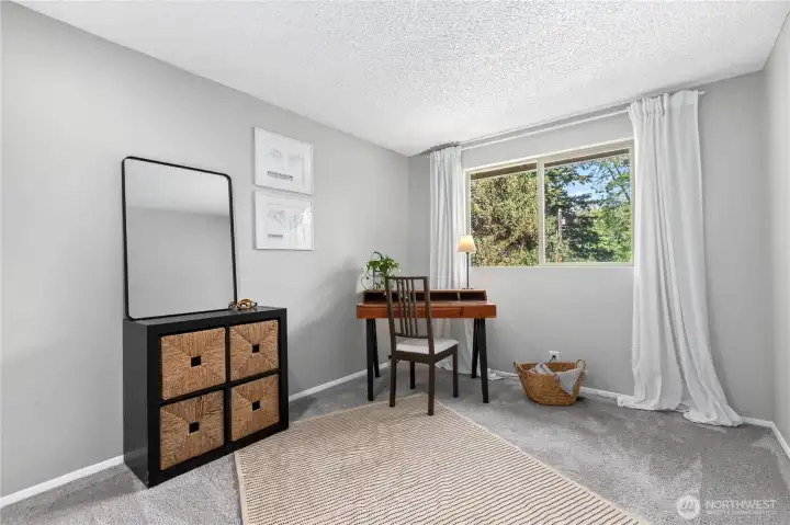 Versatile third bedroom with space for a desk or reading area, making it ideal for remote work, creative pursuits, or overnight visitors. Versatile third bedroom with space for a desk or reading area, making it ideal for remote work, creative pursuits, or overnight visitors.