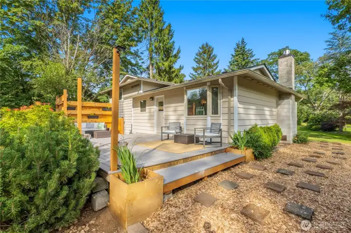 The spacious deck provides multiple seating areas with durable composite decking designed for low-maintenance enjoyment. The spacious deck provides multiple seating areas with durable composite decking designed for low-maintenance enjoyment.