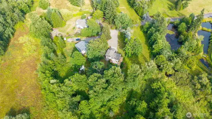 Situated on a generous homesite, the property offers an appealing balance of open lawn, mature landscaping, and wooded surroundings. Situated on a generous homesite, the property offers an appealing balance of open lawn, mature landscaping, and wooded surroundings.