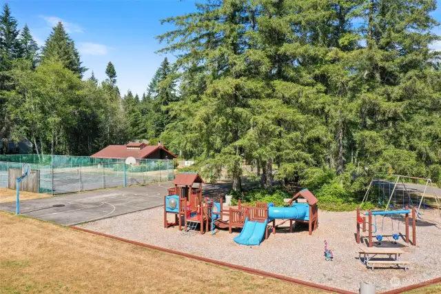 Community recreation area with tennis, basketball, play structures & picnic areas.