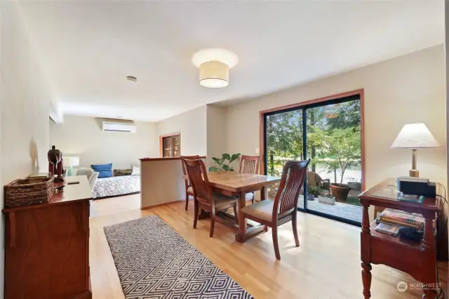 Dining room. Hardwood floor. Sliding glass door with view to lake!