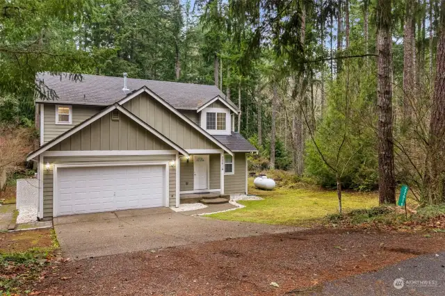 Nestled in the woods! This clean and move in ready 2006 home sits nestled among the trees in beautiful Clearwood. The area behind the home is a clearwood park/forest and there is a vacant lot to the right of the home for peace and quiet.