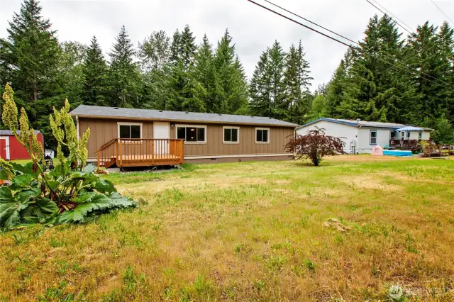Partially upgraded manufactured home on a shy acre; 4 bedrooms, 2 full baths, 1402 sf.