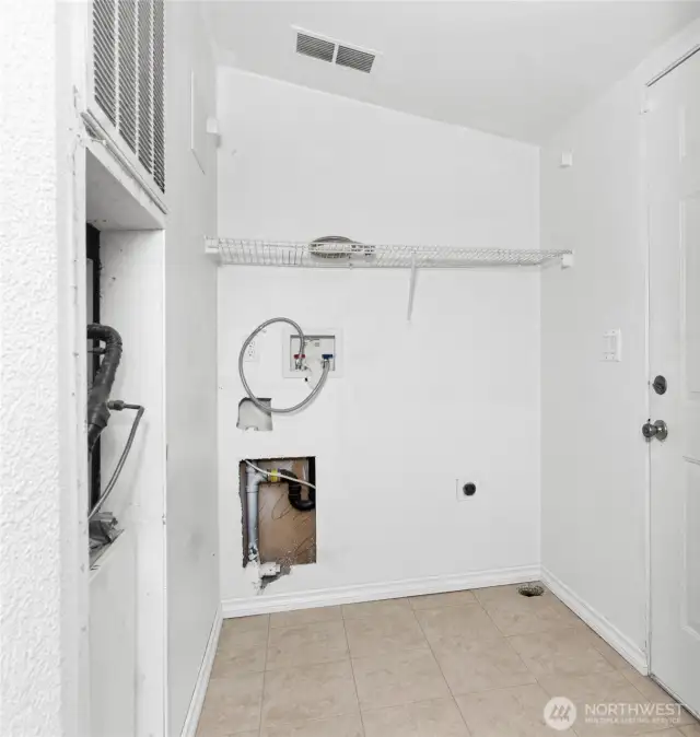 Utility room where washer/dryer would go.