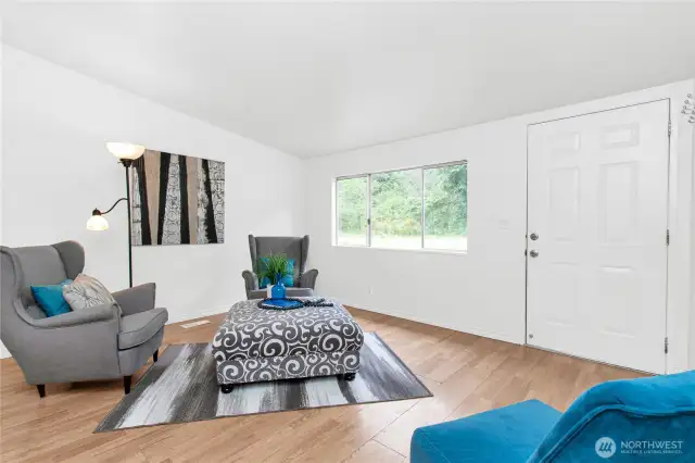 Spacious and open living area, with both living room and additional space off kitchen for eating area or a second gathering area.