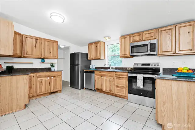 Spacious kitchen with wooden cabinets and all new stainless-steel appliances!!