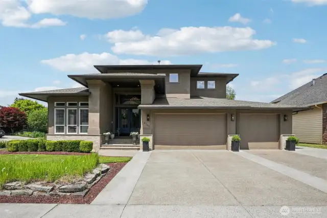 Modern Mediterranean elegance meets timeless curb appeal in this striking RH-inspired façade. Nestled on a premium corner lot, the grand entry, sculpted rooflines, and oversized triple garage create a commanding presence. Crisp landscaping, custom stonework, and manicured symmetry set the tone for the refined experience inside