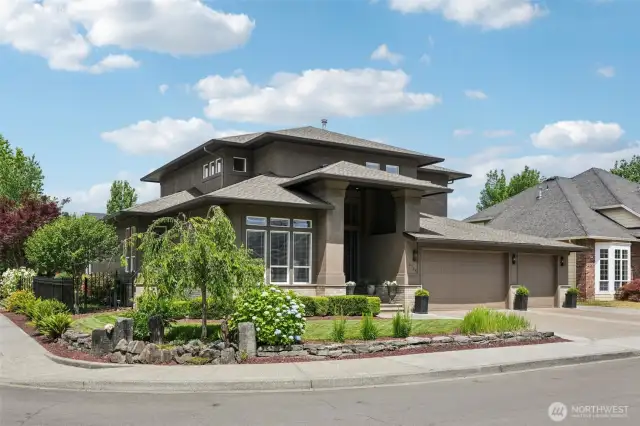 An impressive welcome every time you arrive home. The wide aggregate driveway, artisan planters, and lush greenery offer effortless sophistication, while surrounding upscale homes add to the community’s prestige. A refined lifestyle begins the moment you pull in